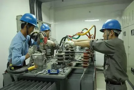 Inspection of an oil-immersed transformer before deciding whether a limited repair, full refurbishment or replacement is technically justified.